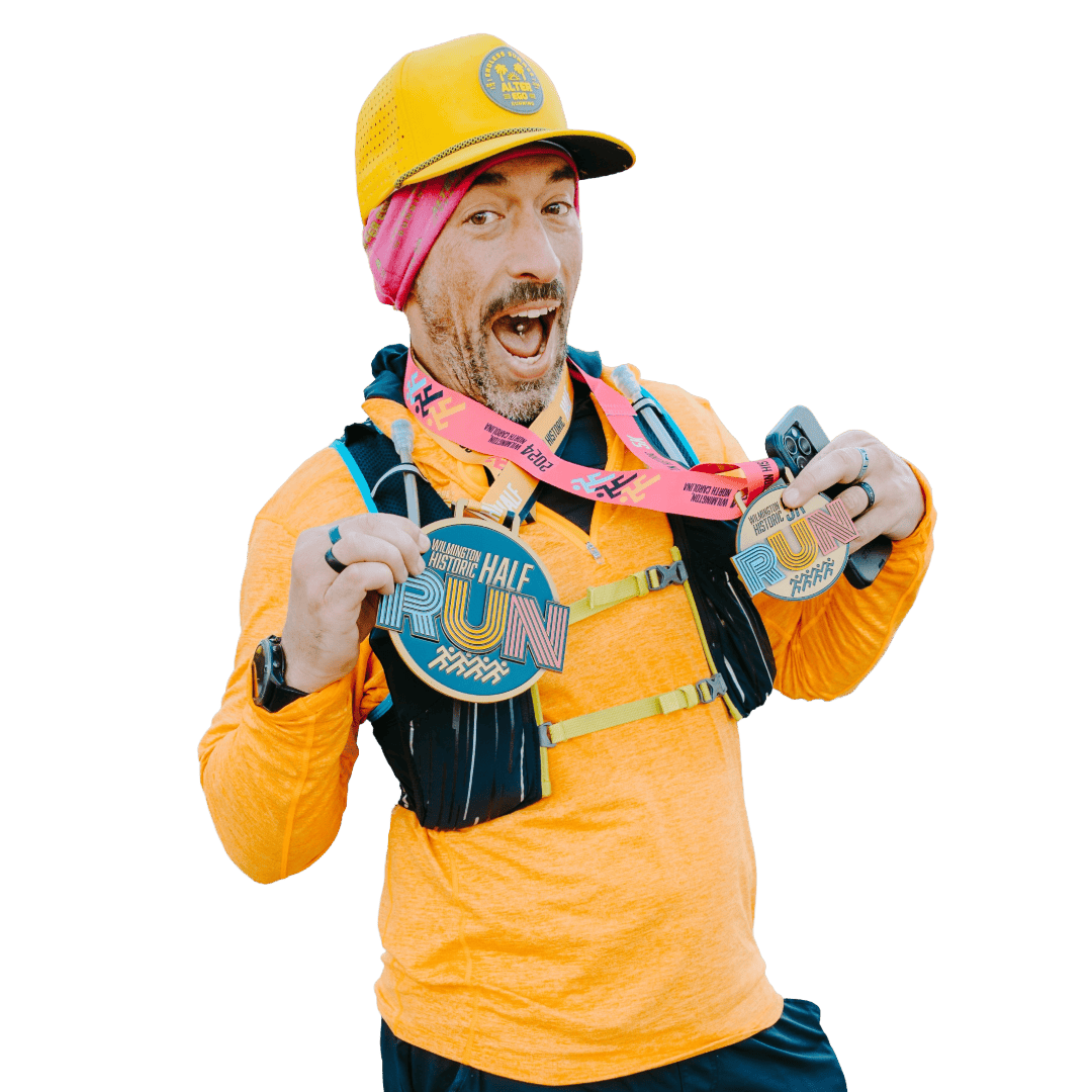 Challenge runner holding medal Challenge runner holding medal